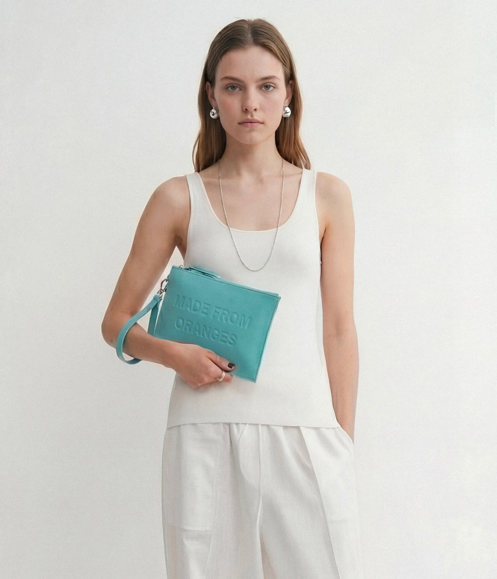 Orion Pouch – Acquamarina (a base di arance)