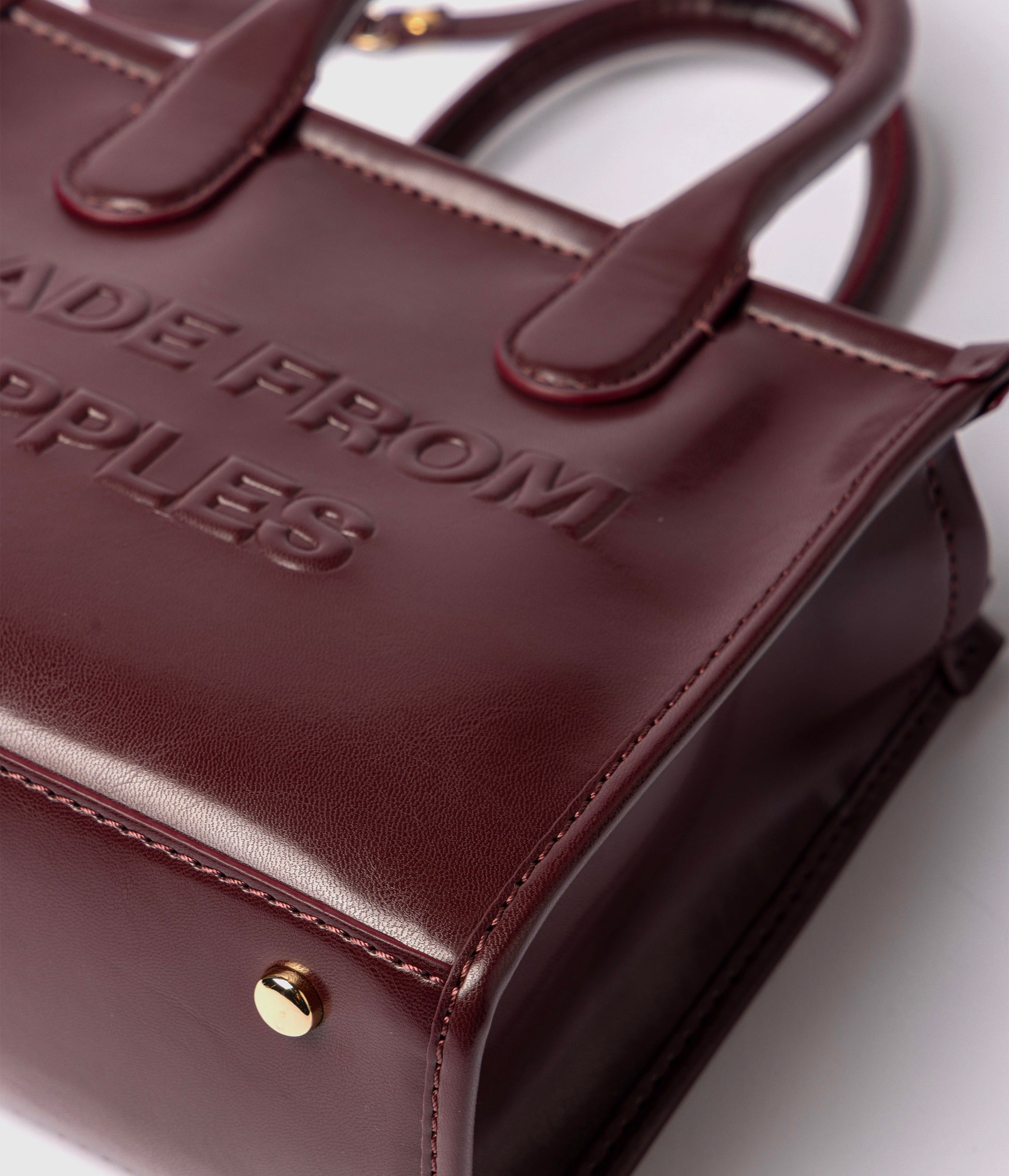 Alima Deluxe Tote M - Rubino (a base di mela)